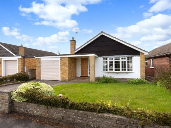Modern UK home with neat front garden and “For Sale” sign